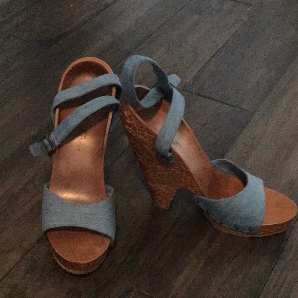 Solid hand etched wood heeled sandals.  Like new, worn one time.